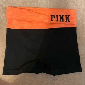 High rise black spandex with a bright orange band
